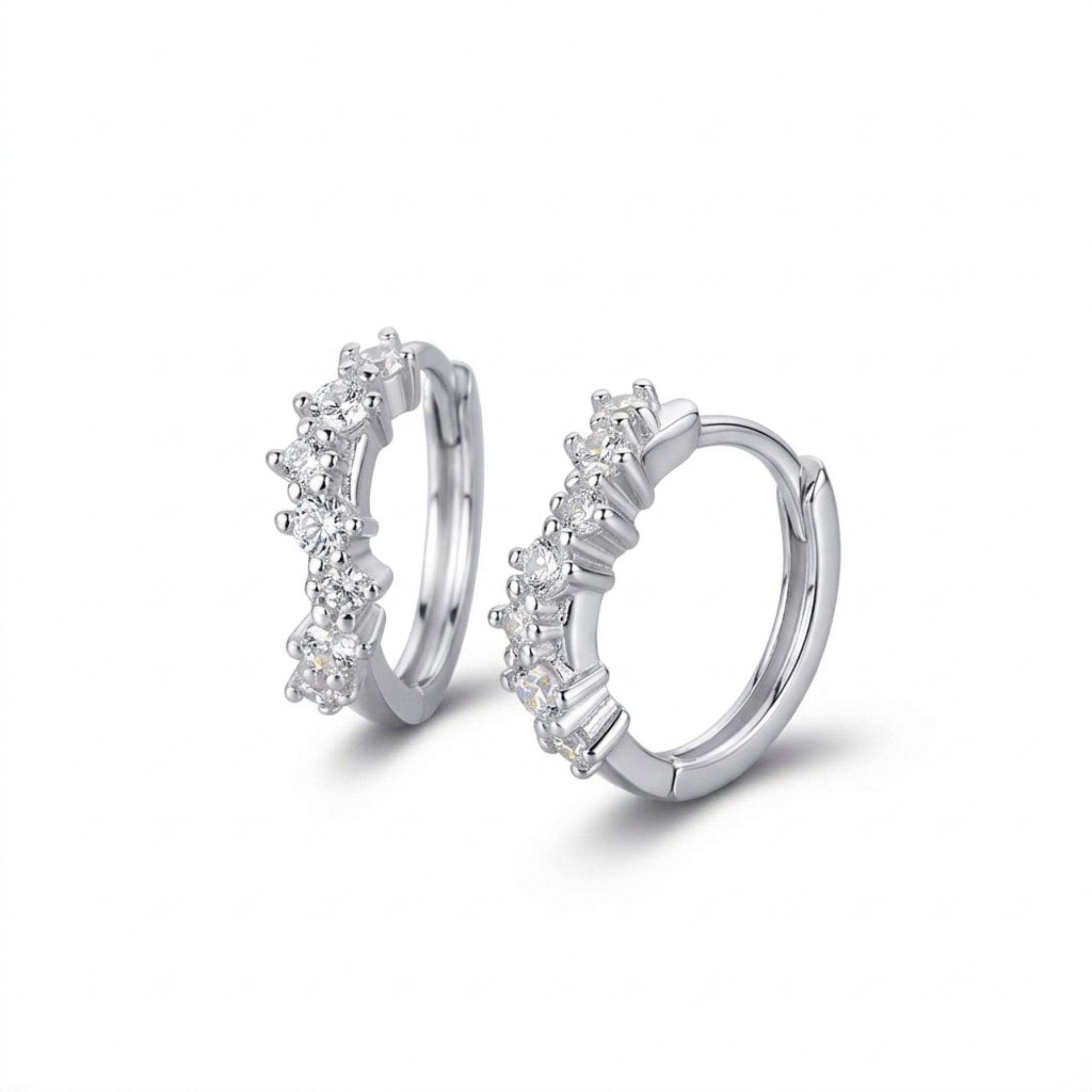 Pair of silver hoop earrings with small diamonds on a white background