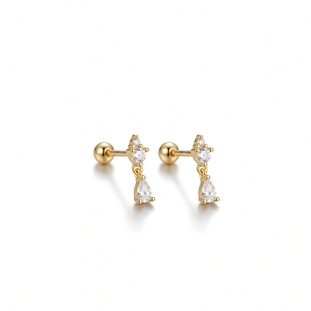 A pair of gold post and cartilage stud earrings, each featuring a small cluster of clear marquise-cut gemstones above a larger pear-cut gemstone, shown on a clean white background.