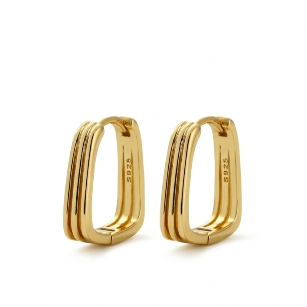 Gold hoop earrings on a white background
