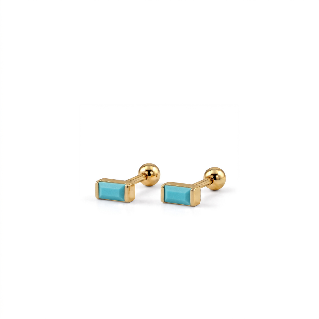 A pair of gold-toned rectangular cufflinks with smooth turquoise blue inlays, displayed on a clean white background.
