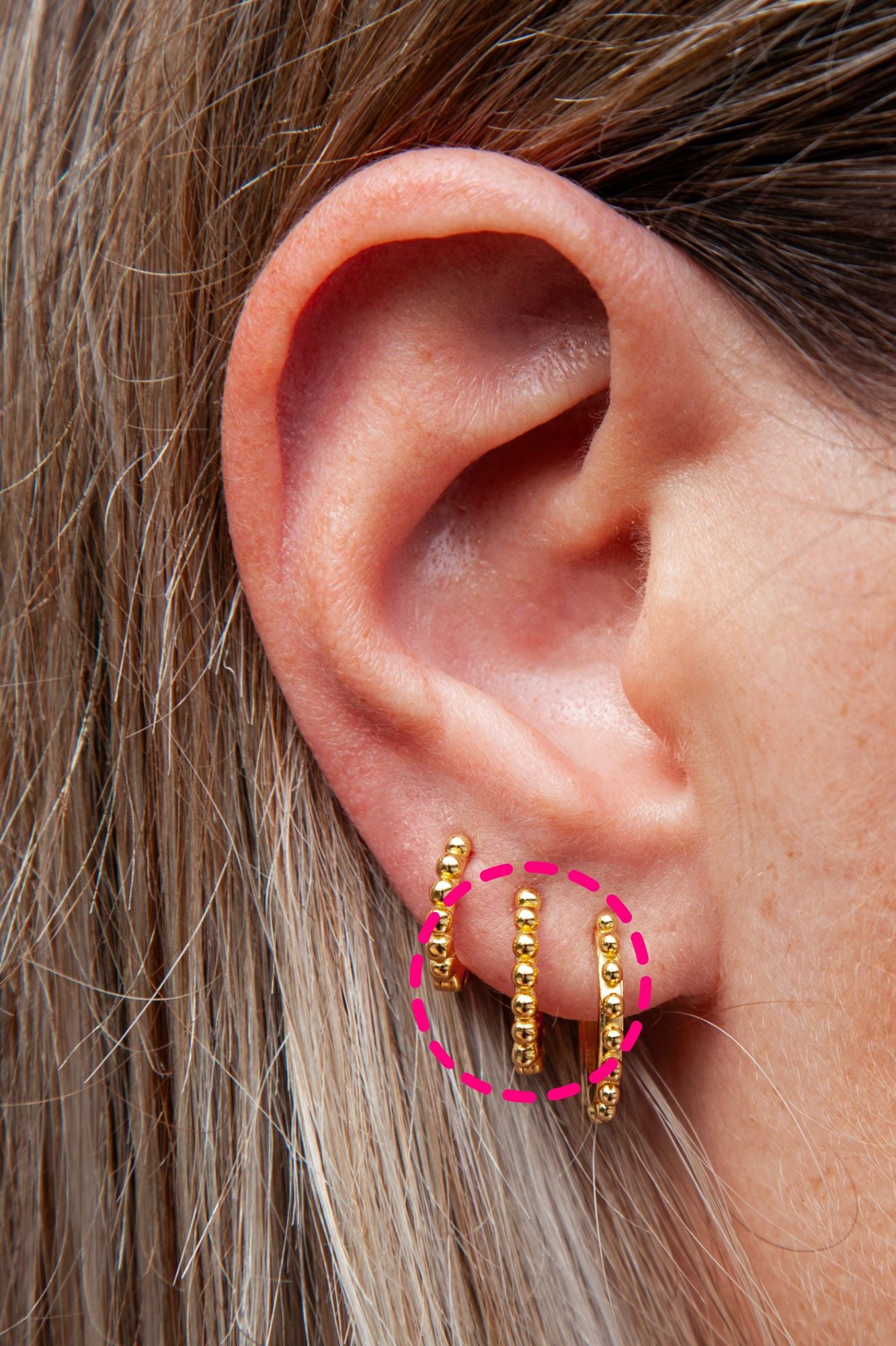 close up of an ear with ear stack with beaded huggies