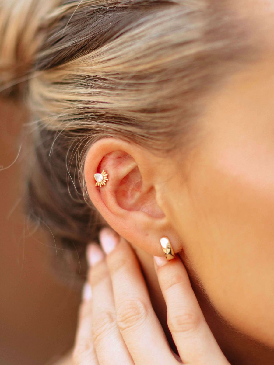 close up of a woman wearing chunky huggies