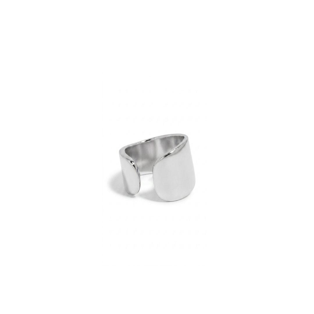 A minimalist silver-toned ear cuff with a smooth, polished finish, photographed on a seamless white background.