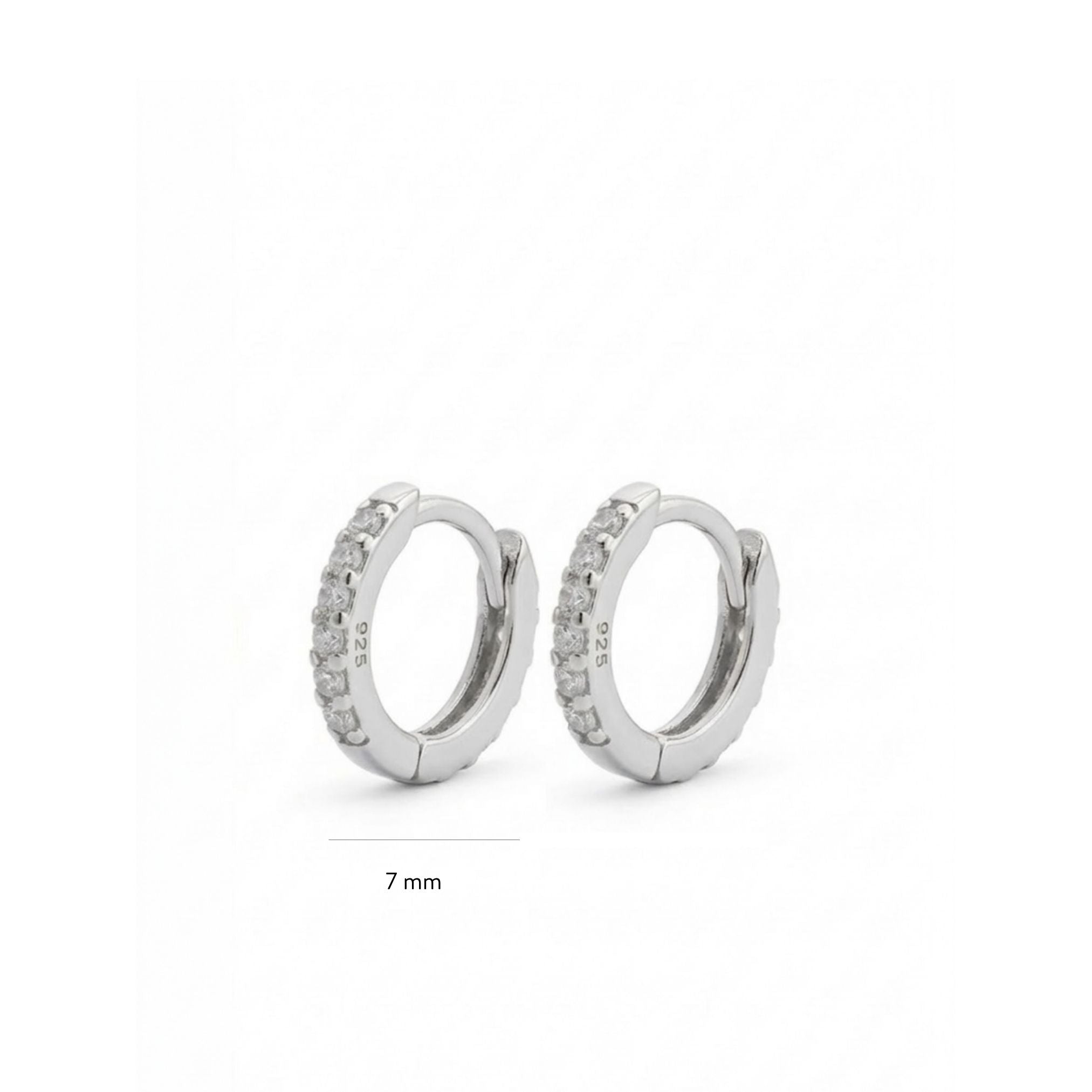 Pair of silver hoop earrings with small stones on a white background 7mm
