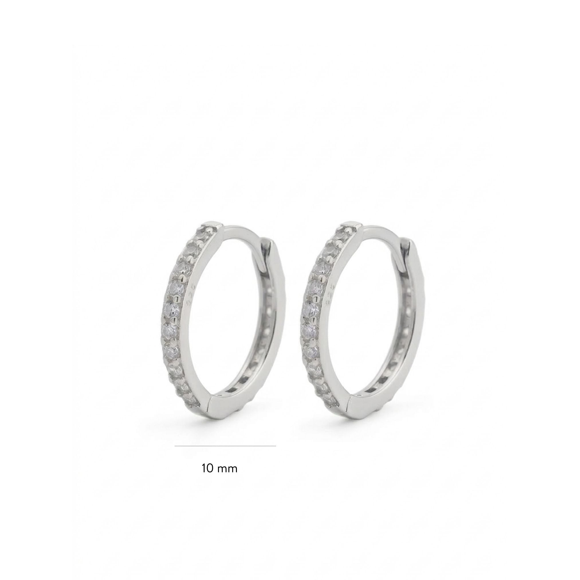 Pair of silver hoop earrings with small stones on a white background