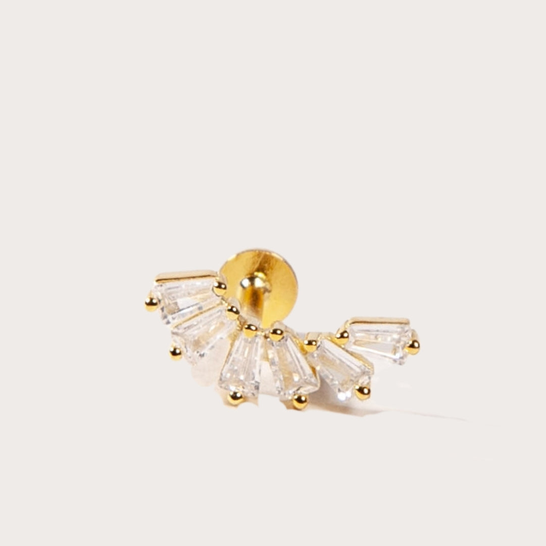 crown-like shape with baguette-cut stones stud in light background
