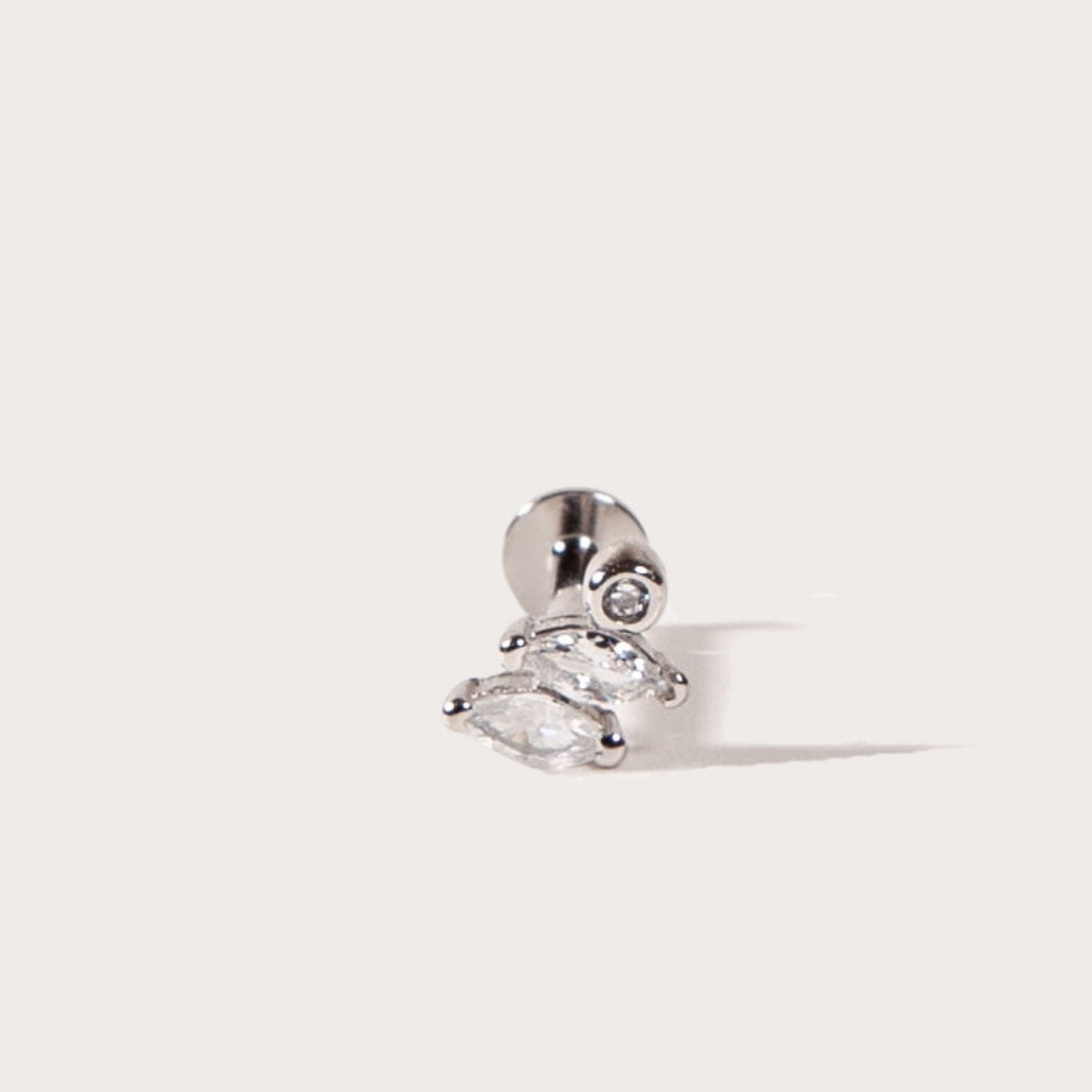 Silver Marquise cut CZ stud earring with a clear gemstone on a light gray background