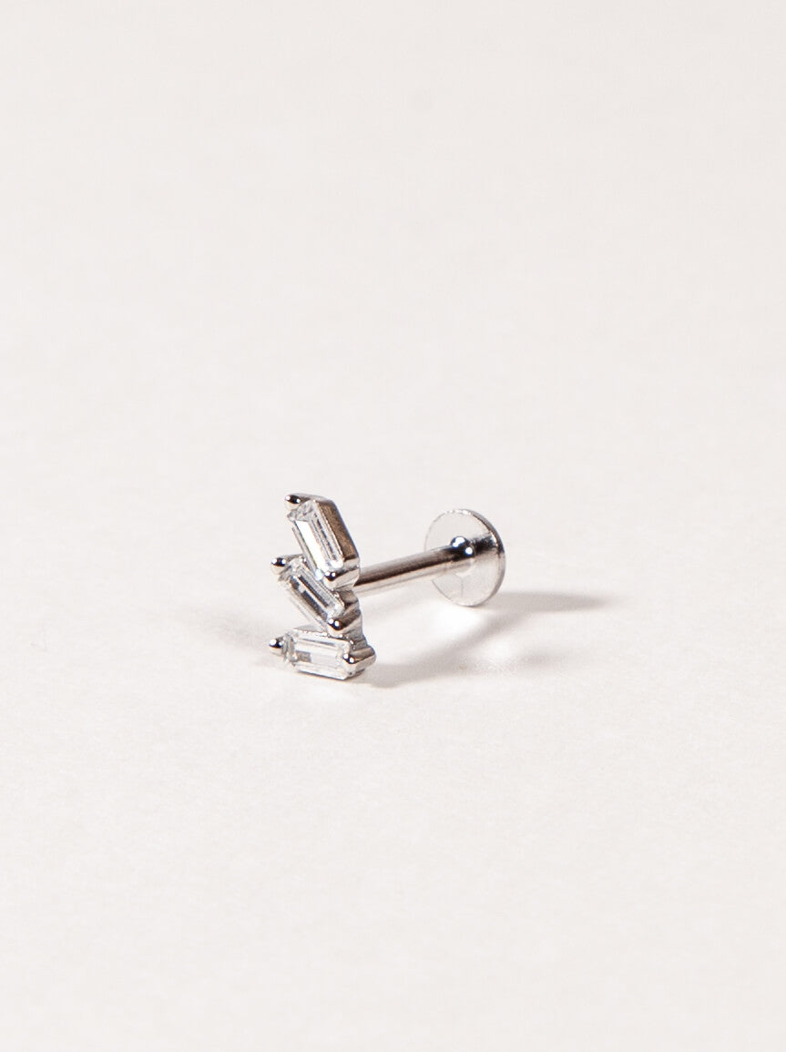 Silver Triple baguette CZ earring on a light gray background