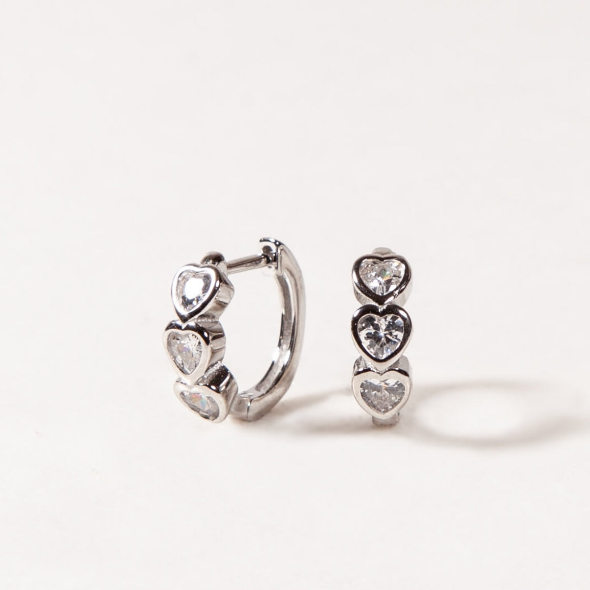 Heart-shaped earrings on a white background