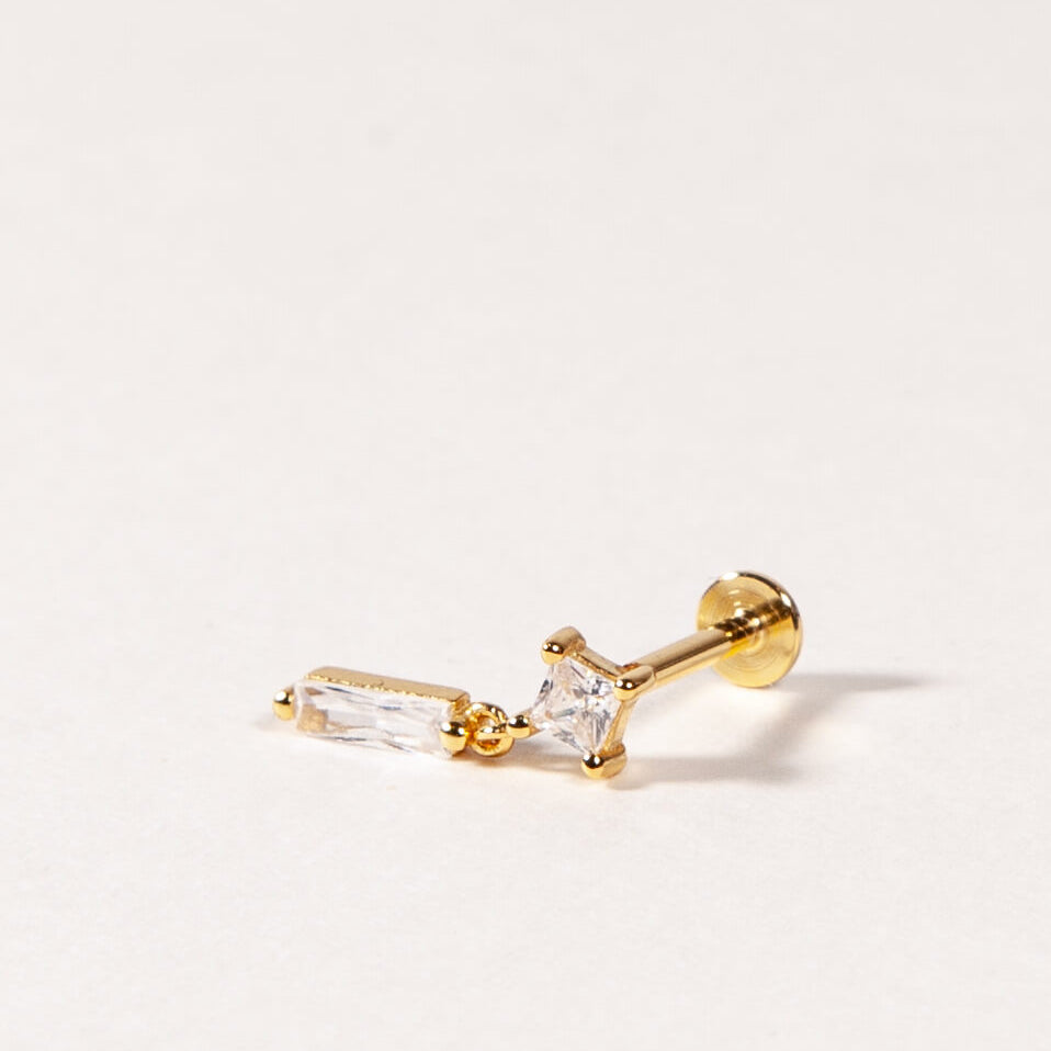A single sterling silver flatback stud with a dangle design and cubic zirconia embellishment.