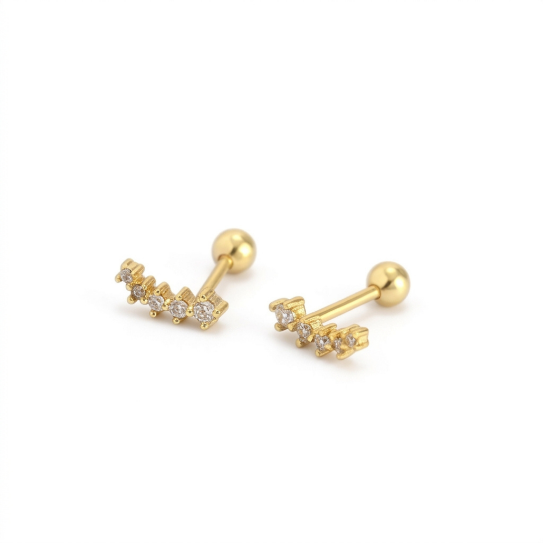 A pair of gold barbell stud earrings with small clear gemstone clusters on each end, displayed on a clean white background.