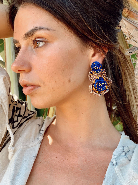 A woman wearing Audrey Bead Embroidery Statement Earrings by Seyyah