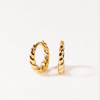 Pair of gold hoop earrings on a white background