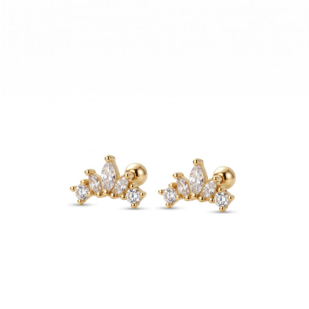 A pair of gold stud earrings featuring marquise and round-cut clear gemstones, displayed on a clean white background.