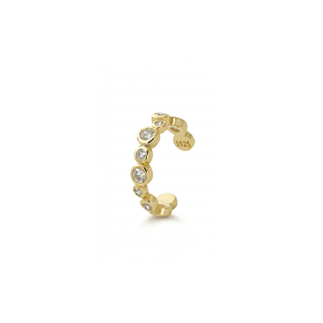 A delicate gold ear cuff adorned with a row of clear round-cut cz, shown on a plain white background. The inner band is stamped with 'S925', indicating sterling silver purity.