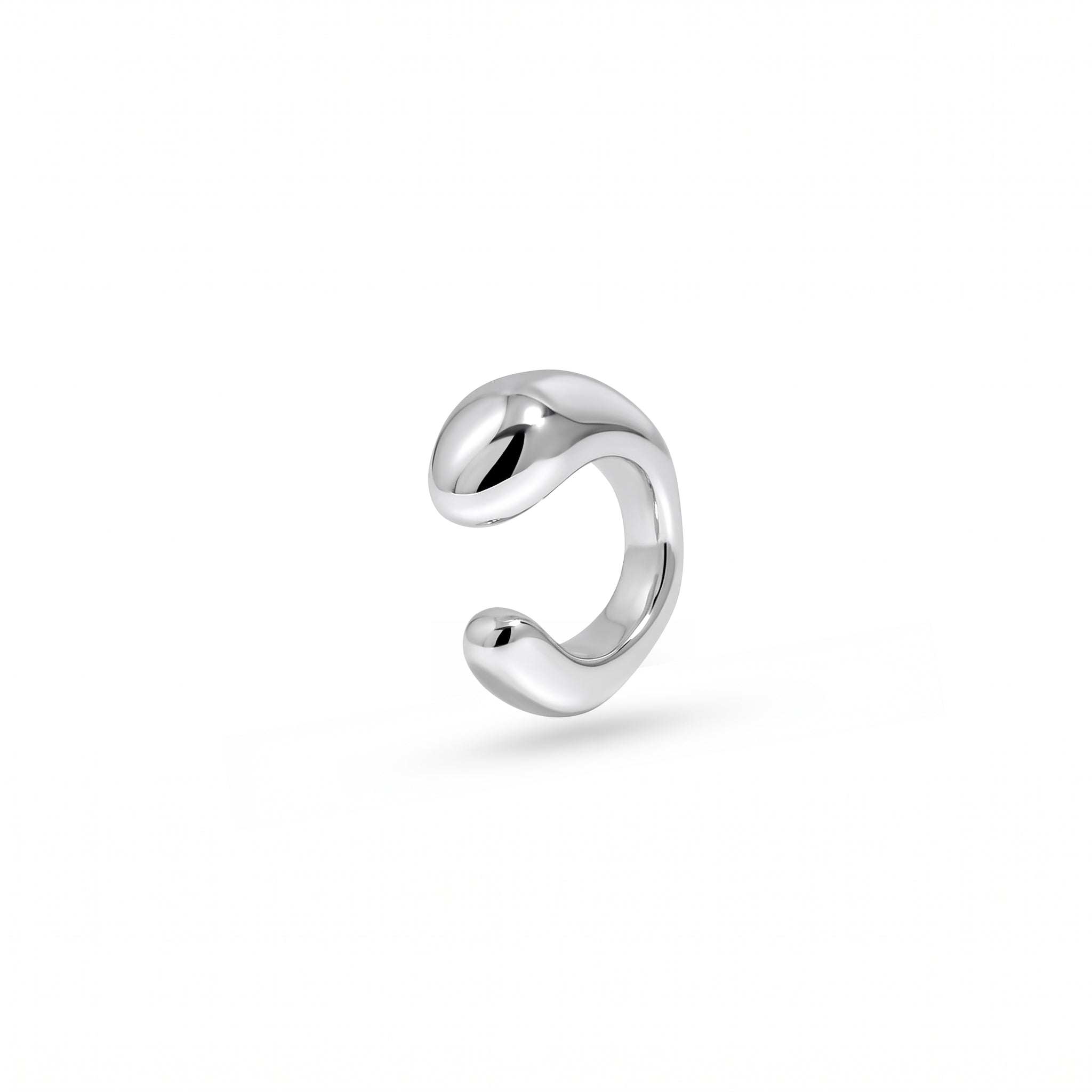 A polished silver cuff with a smooth, organic wavy curve, shown on a clean white background.
