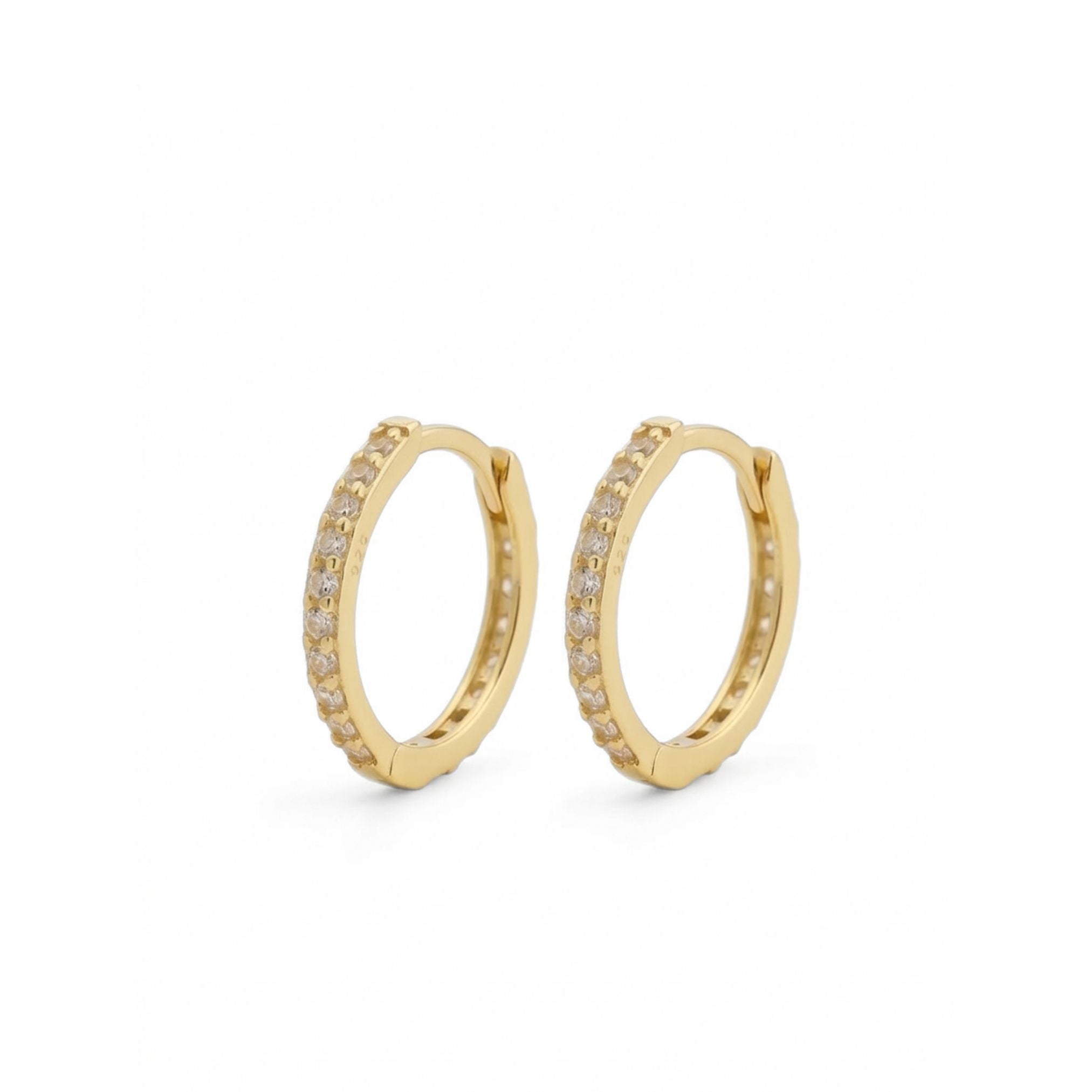 Gold hoop earrings with embedded stones on a white background