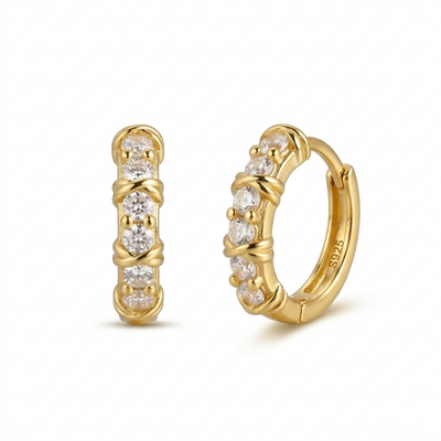 Gold hoop earrings with cz accents on a white background