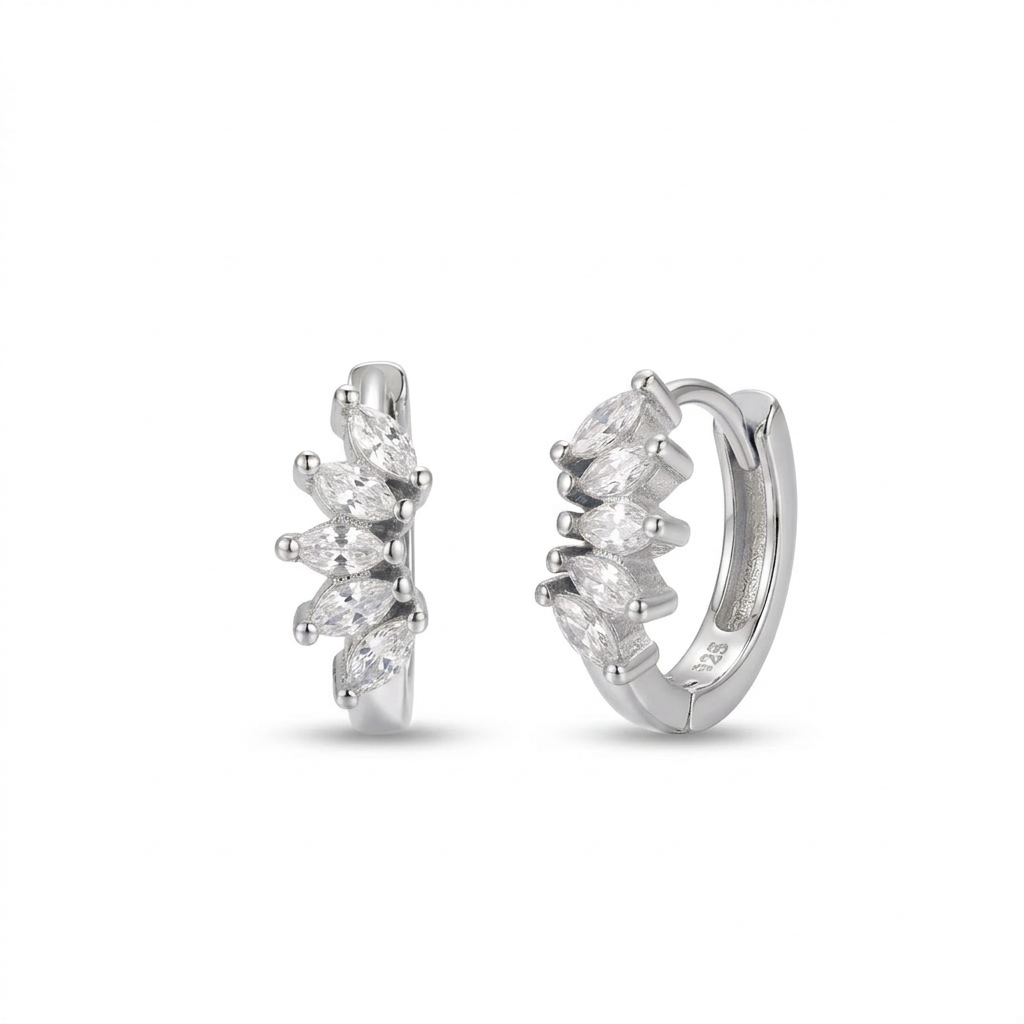 Pair of silver hoop earrings with clear marquise-cut cz on a white background
