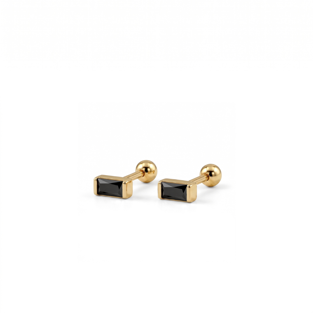 A pair of gold-toned rectangular stud earrings with black rectangular inlays, shown on a clean white background.