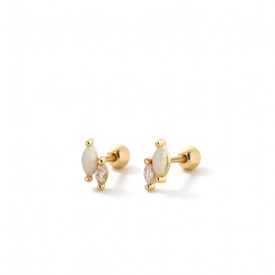 A pair of gold stud earrings featuring marquise-cut opal stones and small clear accent stones, set in polished gold prong settings on a white background.