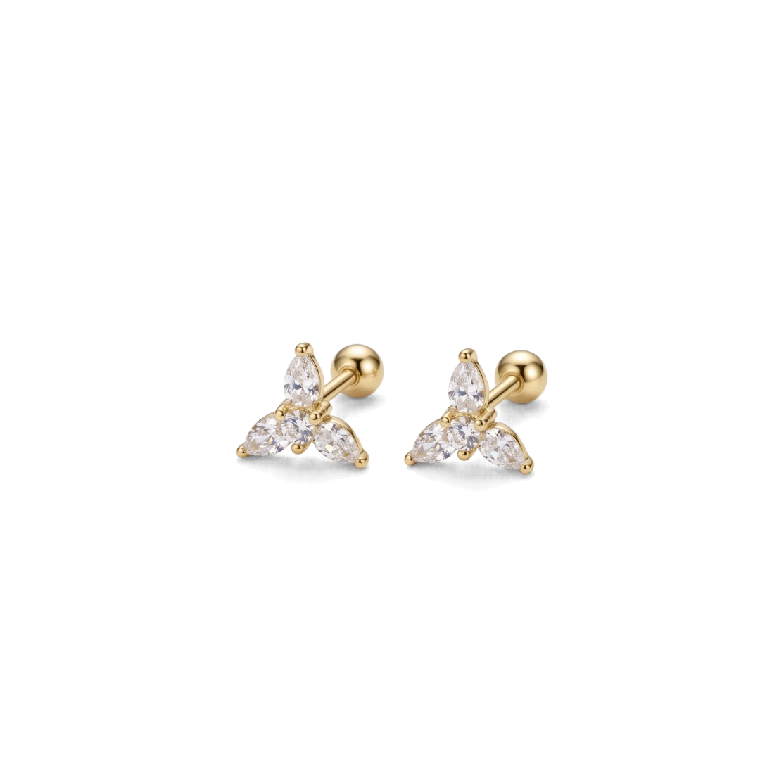 A pair of gold-toned triangular stud earrings with three clear marquise-cut stones, shown on a plain white background.