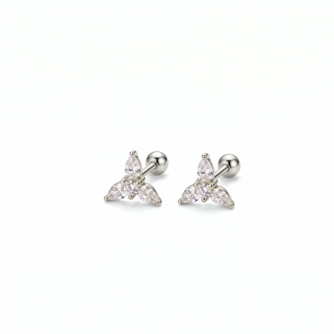 A pair of silver-toned triangular stud earrings with three clear marquise-cut stones, shown on a plain white background.