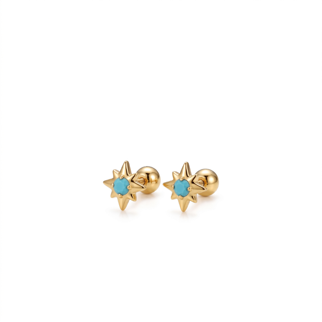 A pair of gold starburst stud earrings with a small round turquoise blue gemstone in the center, shown on a plain white background.