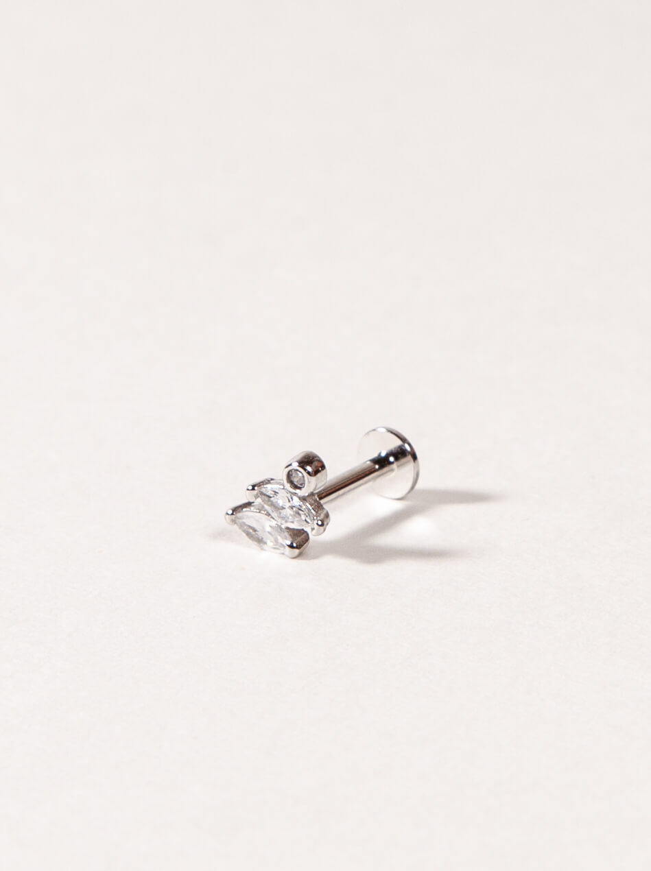 Silver Marquise cut CZ stud earring with a clear gemstone on a light gray background