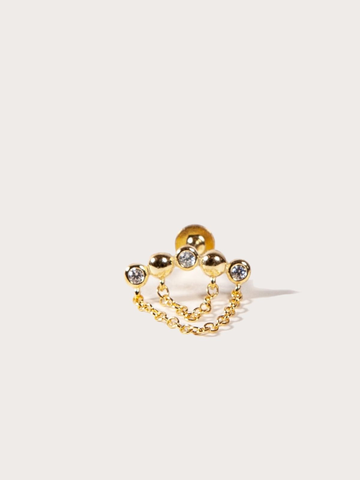 A single gold-colored beaded chain flatback stud earring with cubic zirconia embellishments.