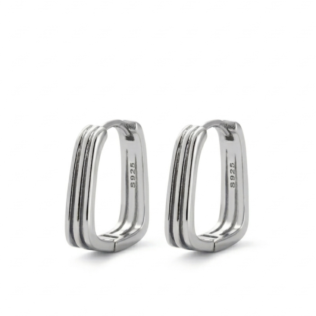Pair of silver hoop earrings on a white background