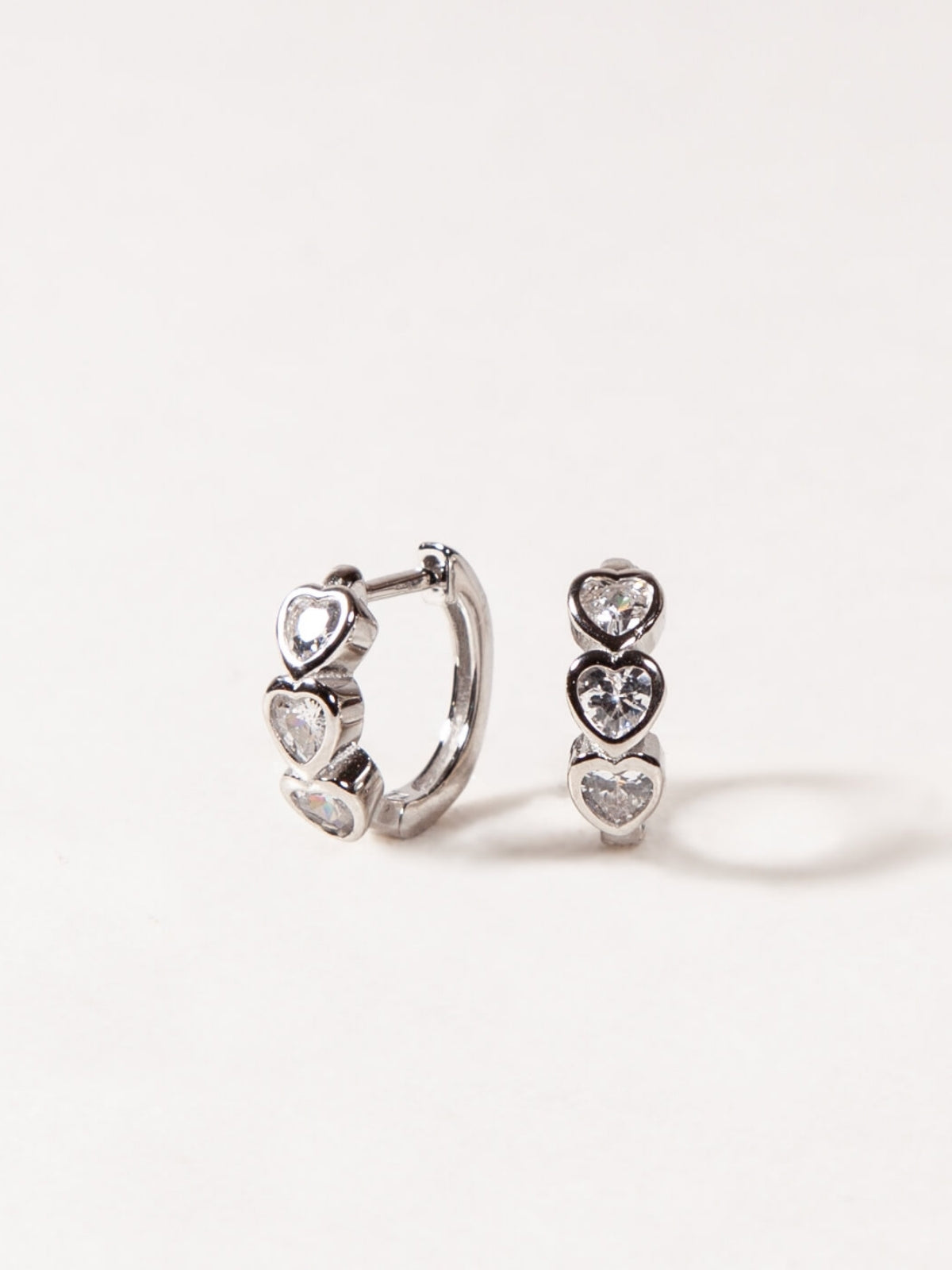 Heart-shaped earrings on a white background