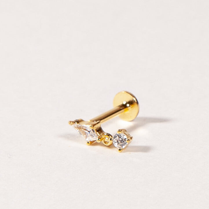 A single gold-colored flatback stud earring with a threaded design and clear cubic zirconia stones on a white background.