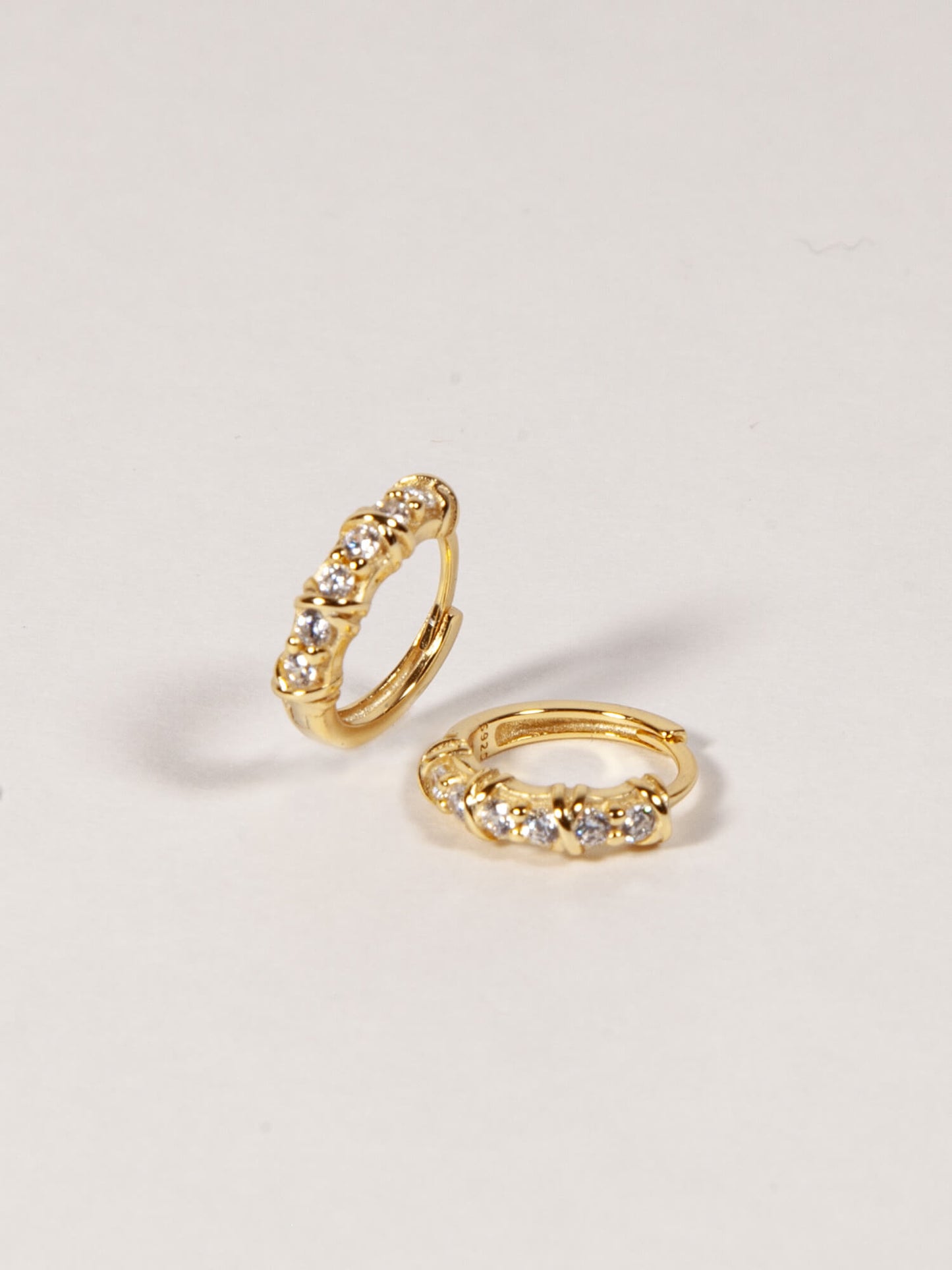 Twisted CZ Huggies in Gold