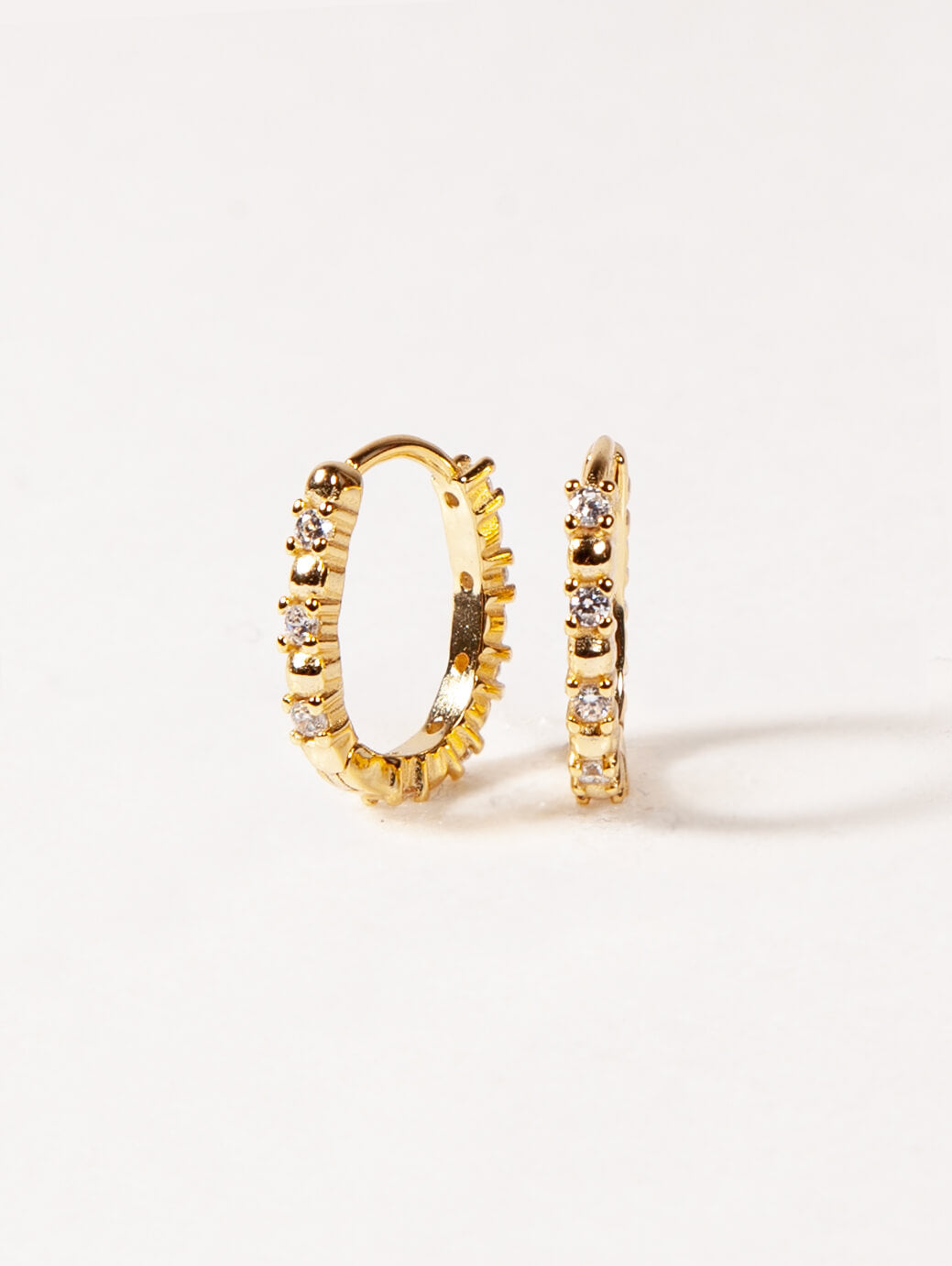 Oval Pave Huggies in Gold