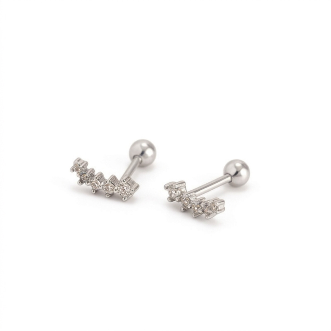A pair of silver-toned labret earrings with curved rows of small clear cubic zirconia stones on the front, shown on a plain white background.