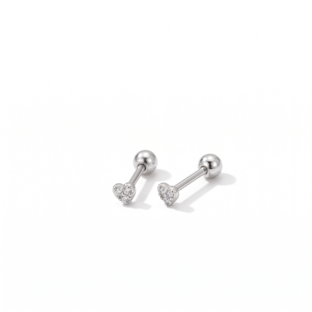 Tiny heart shaped silver studs with ball back closure