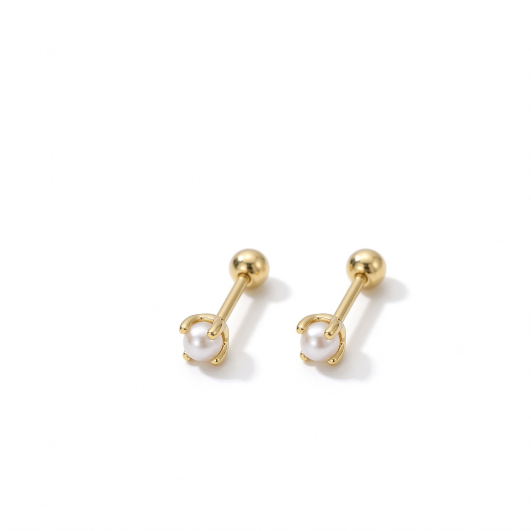 A pair of gold stud earrings with a white pearl in a claw setting, displayed on a clean white background.
