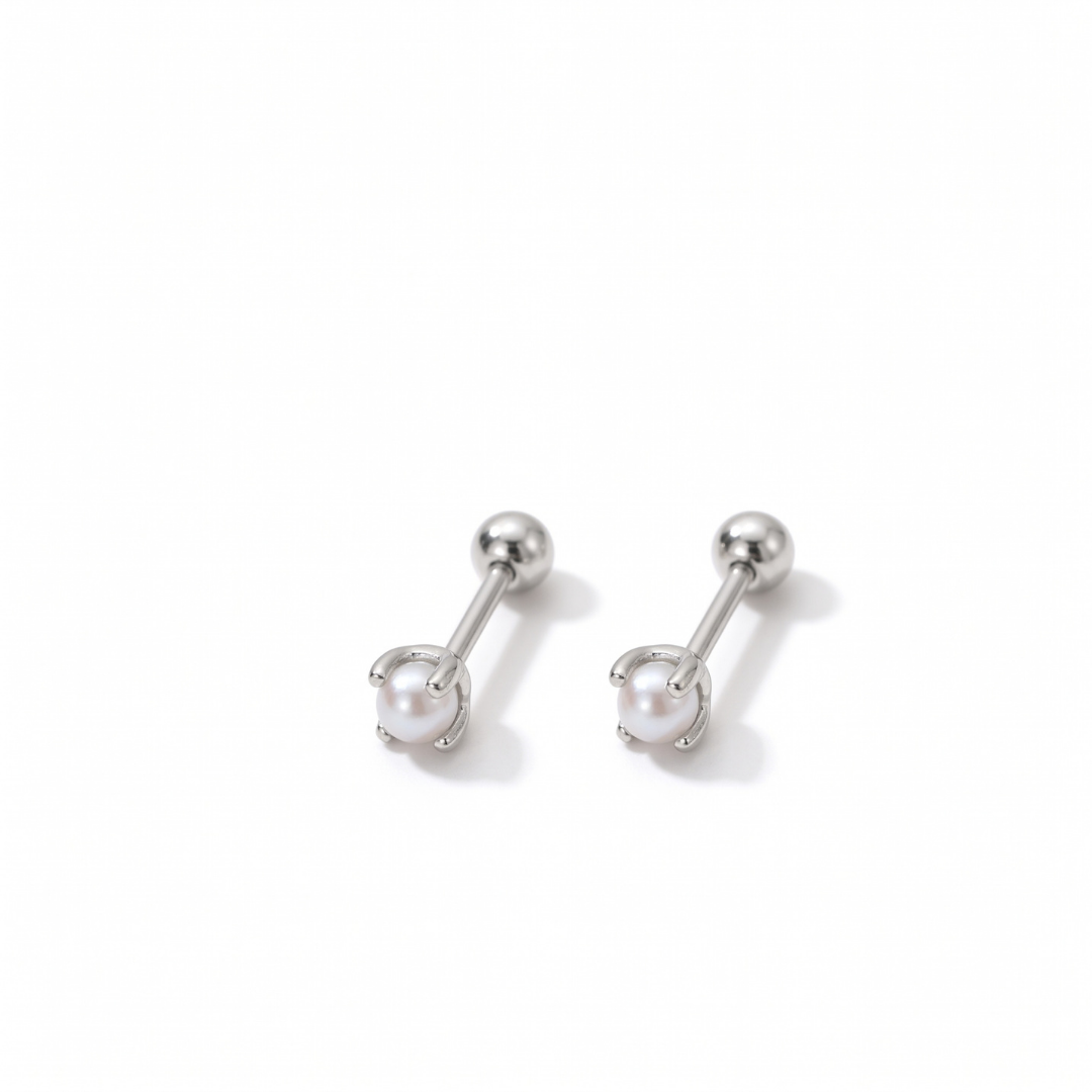 A pair of silver stud earrings with a white pearl in a claw setting, displayed on a clean white background.