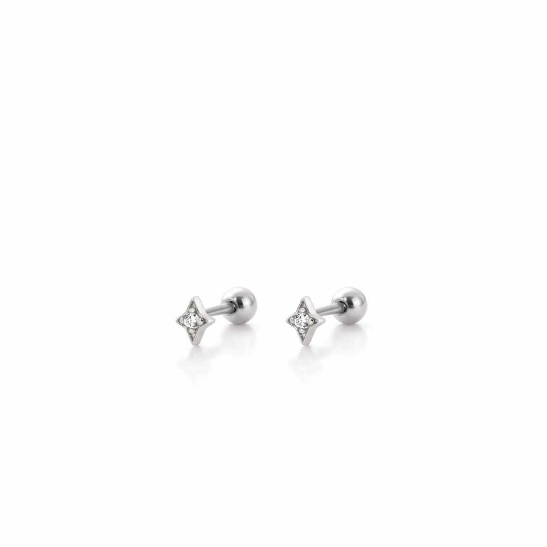 A pair of silver-toned stud earrings with a small four-pointed star design set with clear gemstones, shown on a clean white background.
