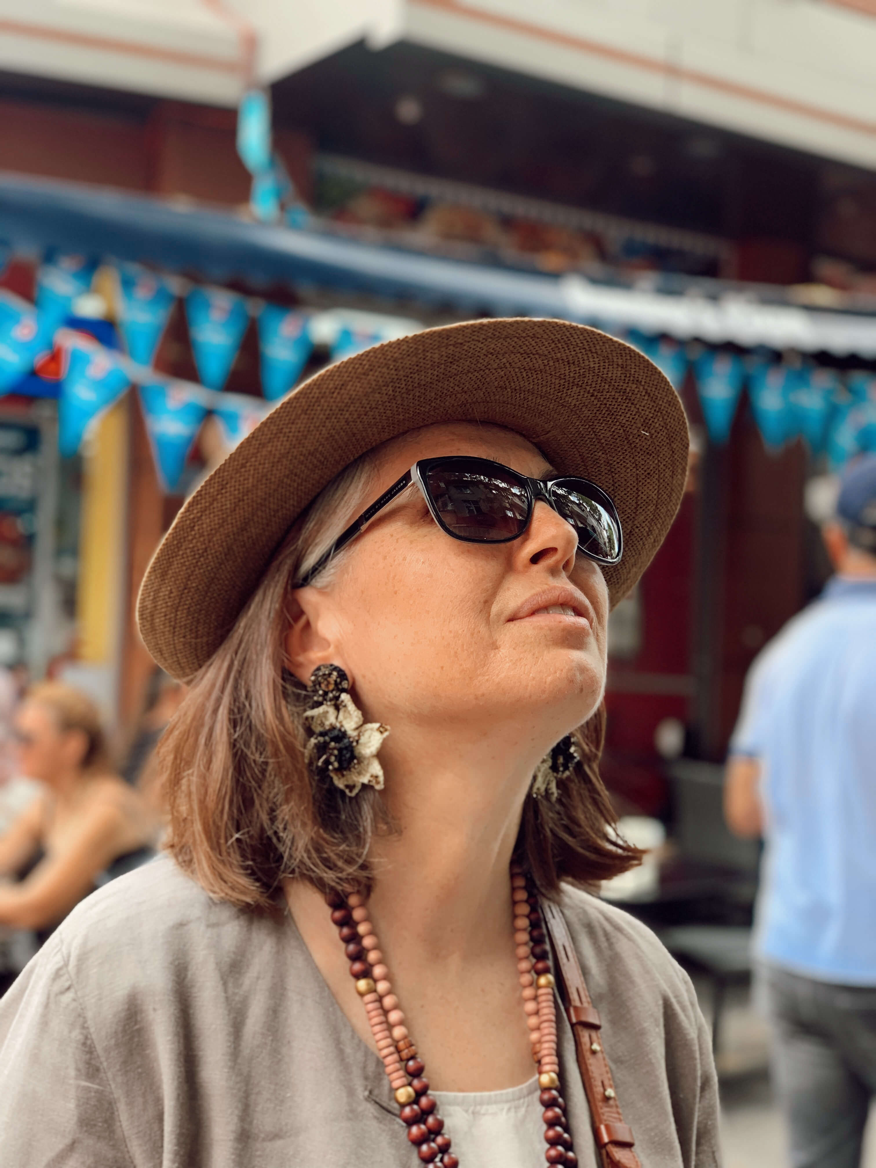 A woman wearing Audrey Bead Embroidery Statement Earrings by Seyyah 